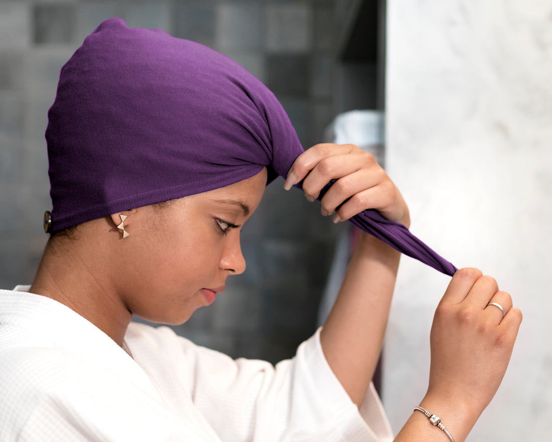 woman using a Purple Plum T-Shirt Hair Towel Hood for Curly, Wavy, and Straight Hair - Soft, Absorbent, and Eco-Friendly