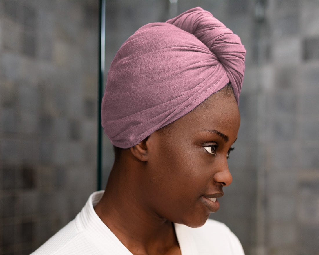 woman using a T-Shirt Hair Towel for Curly, Wavy, and Straight Hair - Soft, Absorbent, and Eco-Friendly in lilac rose