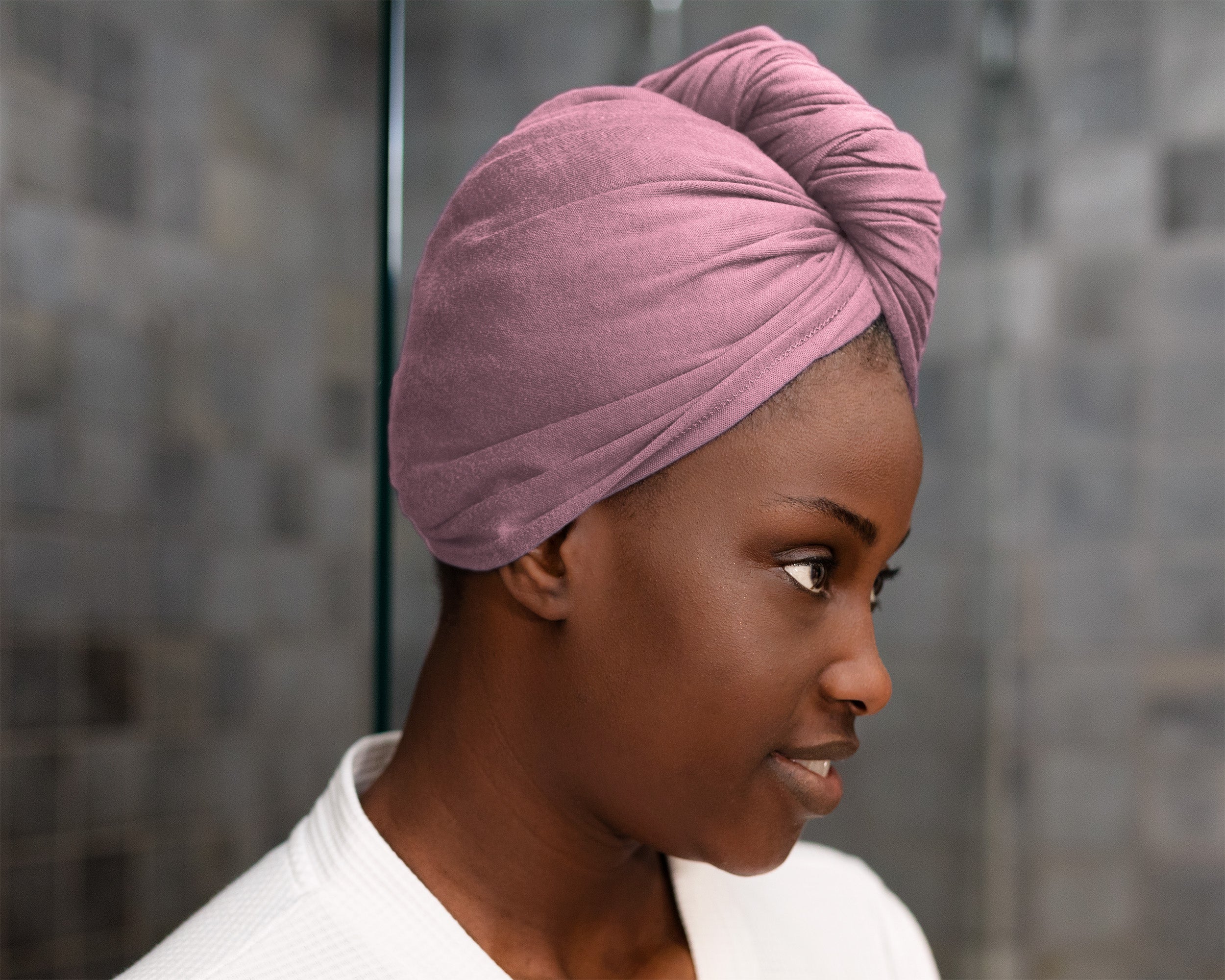 woman using a T-Shirt Hair Towel for Curly, Wavy, and Straight Hair - Soft, Absorbent, and Eco-Friendly in lilac rose