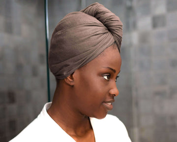 Mocha Mousse eco-friendly hair towel on a woman drying her hair for frizz-free results
