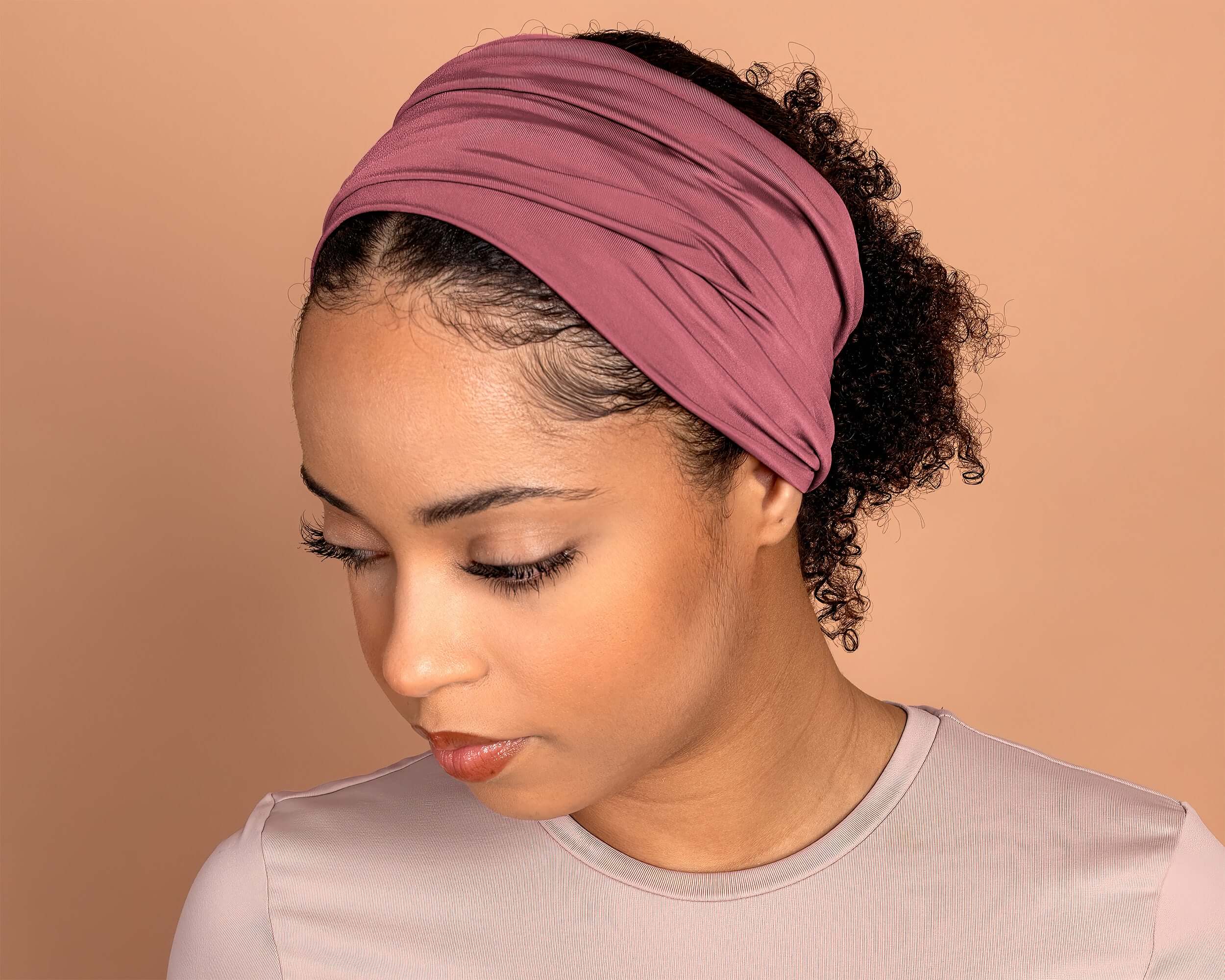 woman wearing a Boho Headband Extra Wide in Mauve Rose