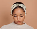 woman wearing a Black & White Twist Stretch Headband