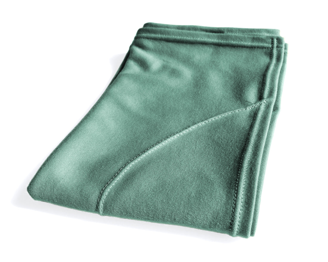 Woman using a T-Shirt Hair Towel for Curly, Wavy, and Straight Hair - Soft, Absorbent, and Eco-Friendly in jade green