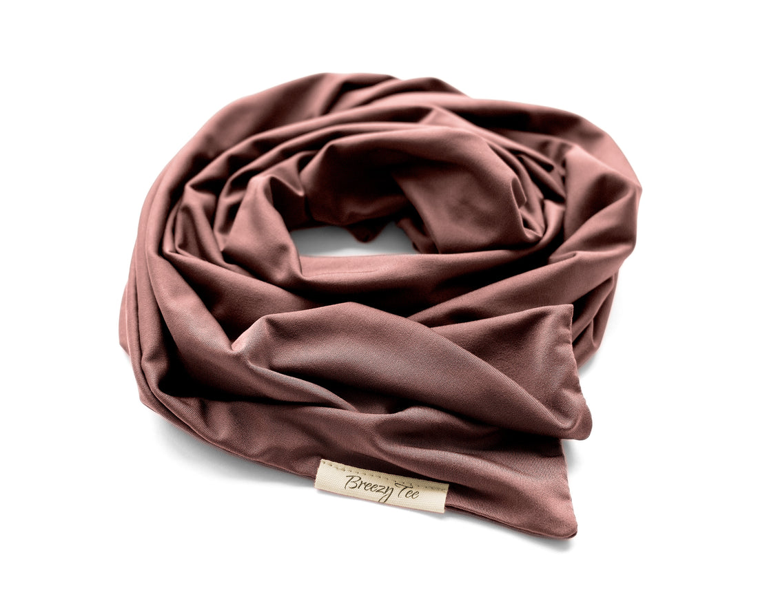 Woman wearing a Wide Boho Hair Wrap in mocha rose color, against a beige background