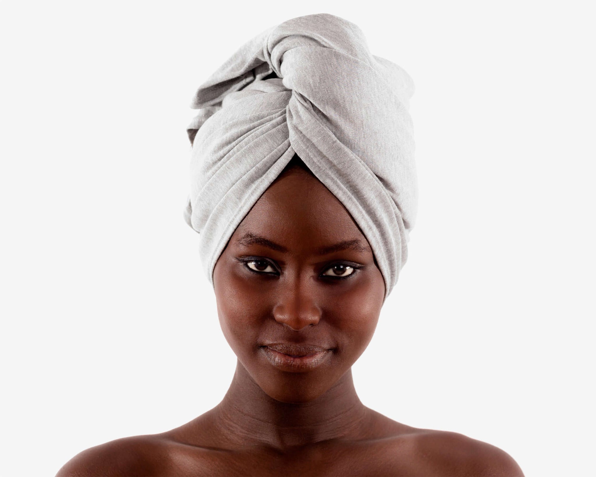 woman using T-Shirt Hair Towel for Curly, Wavy, and Straight Hair - Soft, Absorbent, and Eco-Friendly in Heather Gray