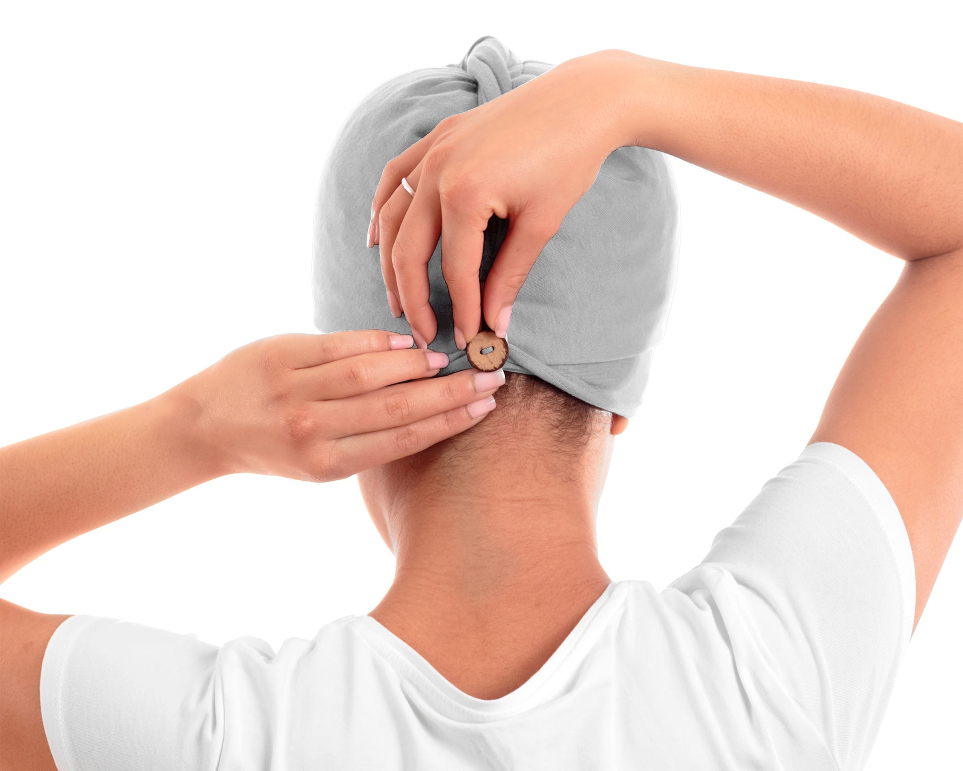 Woman adjusting coconut button of a T-Shirt Hair Towel Hood for Curly, Wavy, and Straight Hair - Soft, Absorbent, and Eco-Friendly in gray, in a bathroom setting