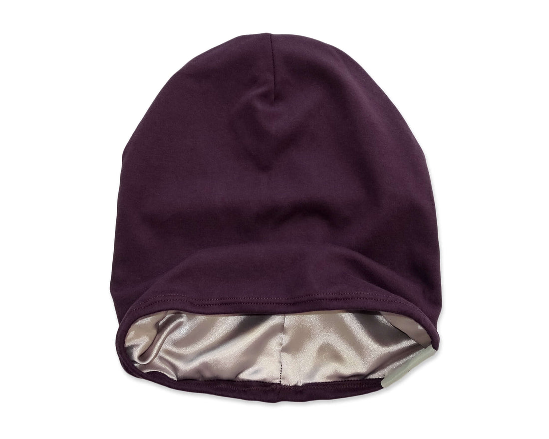 woman wearing a Plum Satin-Lined Beanie for Women and Men - Soft and Warm Beanie with Satin Lining to Protect Hair