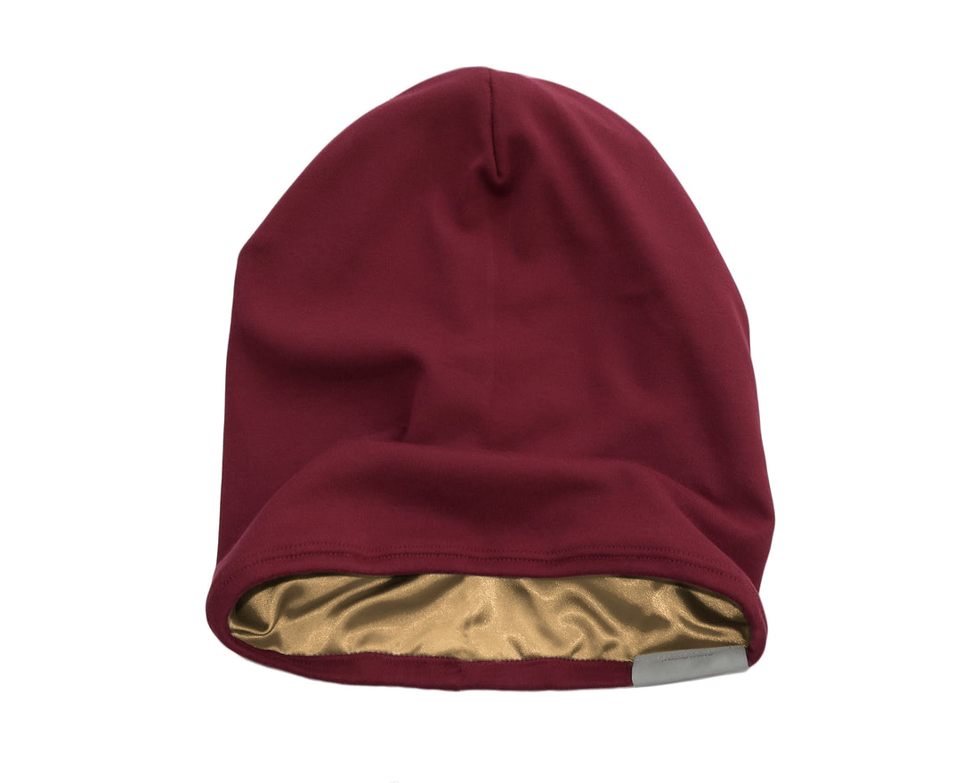Woman wearing Burgundy Red Satin-Lined Beanie for Women and Men - Soft and Warm Beanie with Satin Lining to Protect Hair