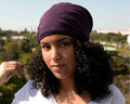 woman wearing a Plum Satin-Lined Beanie for Women and Men - Soft and Warm Beanie with Satin Lining to Protect Hair