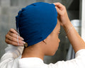 woman using a T-Shirt Hair Towel Hood for Curly, Wavy, and Straight Hair - Soft, Absorbent, and Eco-Friendly, in Royal Blue 